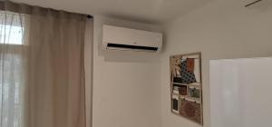 a room with a air conditioner on the wall at Apartamento Playa Las Americas in Playa de las Americas