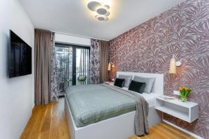 En eller flere senge i et værelse på Apartament I313 Molo Lipno with private wellness