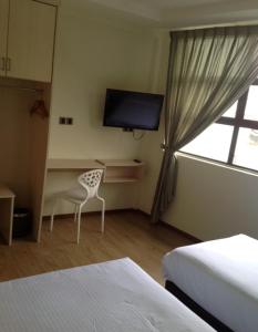 TV a/nebo společenská místnost v ubytování Merlin Hotel Penang
