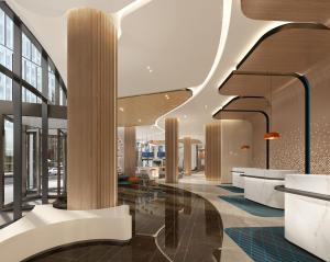 a lobby of a building with columns and windows at Holiday Inn Express Shanghai Pudong Zhangjiang, an IHG Hotel in Shanghai