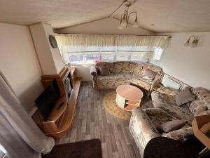 an overhead view of a living room with a couch at Willerby Granada 2-Bedroom Parkhome, Glasgow in Uddingston