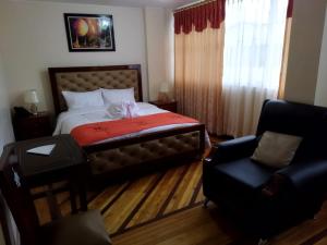 Postel nebo postele na pokoji v ubytování HOTEL VELANEZ SUITE Riobamba