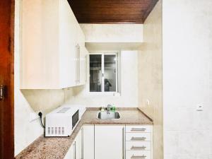 Η κουζίνα ή μικρή κουζίνα στο LISBON Alcântara SeaSide