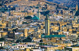 a view of a city with a clock tower at Appartement meublé in Fez