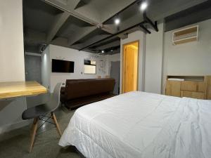 Postel nebo postele na pokoji v ubytování Edificio Helena