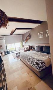 a bedroom with a bed in a room at LOFT VIEW SEA The best ubication at 5th AV in Playa del Carmen