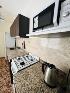 Dapur atau dapur kecil di San Luis Apartment +11 gambar