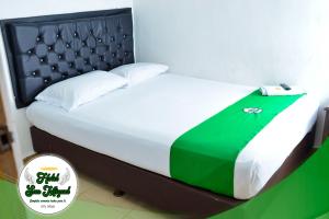 Postel nebo postele na pokoji v ubytování Hotel San Miguel Apartadó