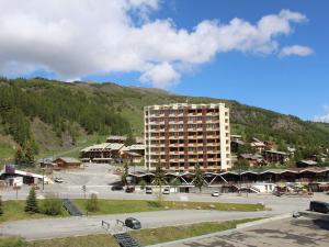 a large building in front of a mountain at Studio Cabine 4 Pers. avec Balcon, au Pied des Pistes à Vars Les Claux - FR-1-330B-143 in Vars