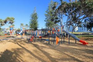 a playground with a slide in a park at 46 Holland Street Bargara in Bargara