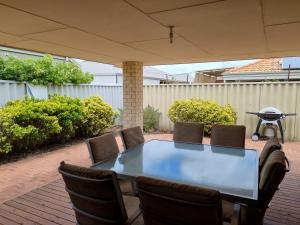 a table and chairs sitting on a patio at Busselton Broadwater Holiday Home in Busselton