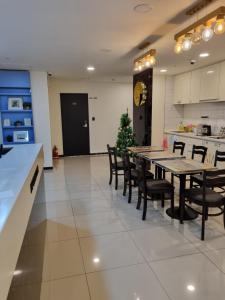 a dining room with a long table and chairs at K9 Myeongdong Hotel in Seoul