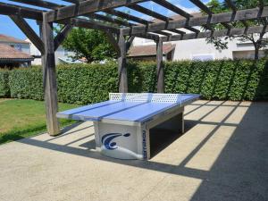 a picnic table sitting under a wooden pergola at Maison Duplex 6 Pers. avec Terrasse, Piscine Chauffée et Climatiseur - FR-1-382-121 in Vallon-Pont-dʼArc