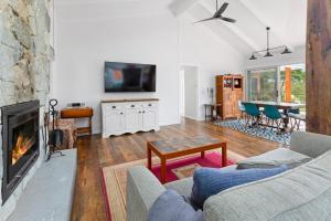 a living room with a couch and a fireplace at Endless Somers in Somers