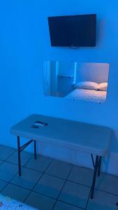 a blue room with a table and a bed at Laguna 02 in Tampico
