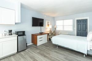 Postel nebo postele na pokoji v ubytování Echo Sails Motel