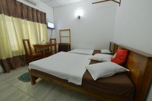 Postel nebo postele na pokoji v ubytování Venus Resorts