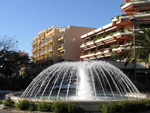 a water fountain in front of a building at Appartement 2 pièces, climatisé, 100m plage, parking, Le Lavandou - FR-1-251-218 in Le Lavandou +12 photos