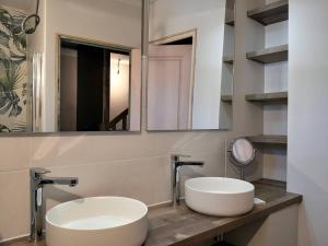 two sinks in a bathroom with two mirrors at Maison Villard-de-Lans, 5 pièces, 8 personnes - FR-1-548-26 in Villard-de-Lans