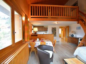 a kitchen and dining room with a table in a house at Appartement Le Grand-Bornand, 3 pièces, 6 personnes - FR-1-241-189 in Le Grand-Bornand