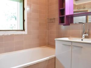 a bathroom with a bath tub and a sink at Appartement 3 pièces, 6 pers, proche pistes, parking - FR-1-180-365 in Les Allues +27 photos