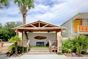 a pavilion with two chairs and a bench at Holiday Shores in Myrtle Beach