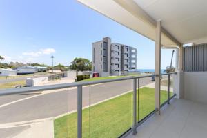 a balcony with a view of the ocean at Unit 3 Everdell Street in Bargara