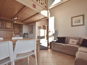 a living room with a couch and a table at Appartement Le Grand-Bornand, 4 pièces, 8 personnes - FR-1-391-3 in Le Grand-Bornand