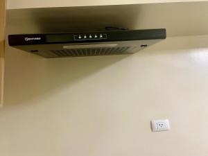 a air conditioner is hanging from a ceiling at Avida Aspira Condotel in Cagayan de Oro +15 photos