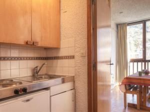 a kitchen with a sink and a counter top at Charmant studio à Chantemerle, Serre-Chevalier pour 2 pers, parking et casier à ski inclus - FR-1-330E-67 in Saint-Chaffrey