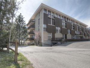 a large building with a road in front of it at Charmant studio à Chantemerle, Serre-Chevalier pour 2 pers, parking et casier à ski inclus - FR-1-330E-67 in Saint-Chaffrey