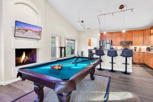 a pool table in a living room with a fireplace at KING Bed, Pool, Pool Table, Fireplace in Peoria