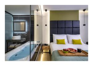 Postel nebo postele na pokoji v ubytování Platinum Suites