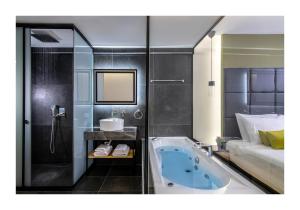 Posteľ alebo postele v izbe v ubytovaní Platinum Suites