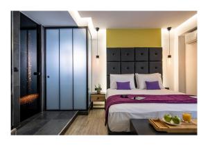 Postel nebo postele na pokoji v ubytování Platinum Suites