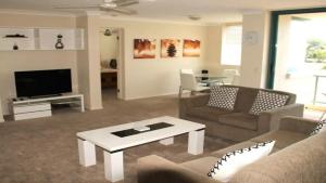 a living room with a couch and a coffee table at Burleigh Terraces - Hosted by Burleigh Letting in Gold Coast