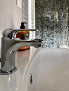 a bathroom sink with a faucet on top of it at Healthy Flat Bologna - Tower Skyline View in Bologna +62 photos