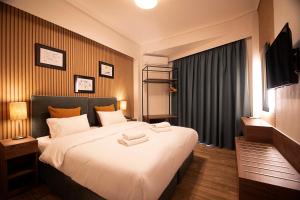 Postel nebo postele na pokoji v ubytování FALIREON HOTEL