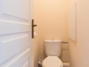 a bathroom with a white toilet in a room at Appartement cosy 2 pièces avec parking, proche pistes - La Salle-les-Alpes - FR-1-330F-46 in Serre Chevalier