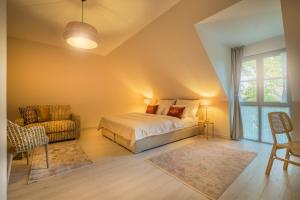 Postel nebo postele na pokoji v ubytování Arkady Hof Hotel