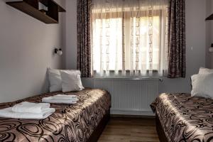 Casa Tofi Vendégház客房内的一张或多张床位