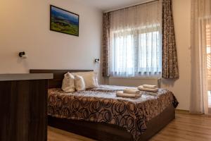 Casa Tofi Vendégház客房内的一张或多张床位