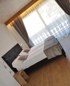 Posteľ alebo postele v izbe v ubytovaní Residence Anda