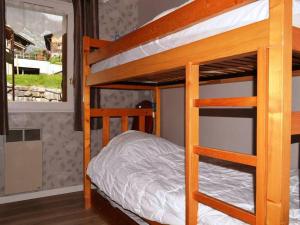 a bunk bed in a room with a bunk bed in a house at Appartement Le Grand-Bornand, 2 pièces, 5 personnes - FR-1-241-167 in Le Grand-Bornand