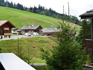 a view of a village with a pine tree at Appartement Le Grand-Bornand, 2 pièces, 5 personnes - FR-1-241-167 in Le Grand-Bornand