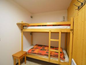 a bunk bed room with two bunk beds in it at Studio Le Grand-Bornand, 1 pièce, 4 personnes - FR-1-241-173 in Le Grand-Bornand