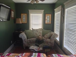 a living room with a couch and two windows at The Destination B&B llc in Salem