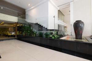 a large vase sitting on a counter in a lobby at Mira Business Hotel in Riyadh