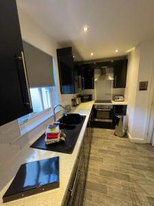 a kitchen with a sink and a counter top at 2 Laurel Court in Ulverston