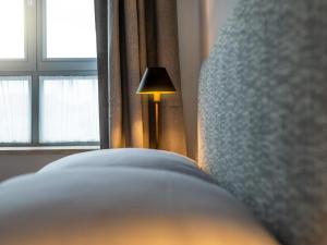 Postel nebo postele na pokoji v ubytování Arkady Hof Hotel